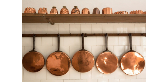 Copper Copper pans hanging on wall