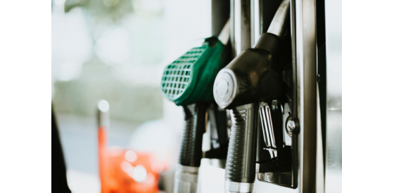 Two gas pumps with blurred background at a petrol station