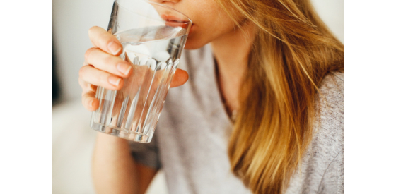 Woman drinking a glass of clean water